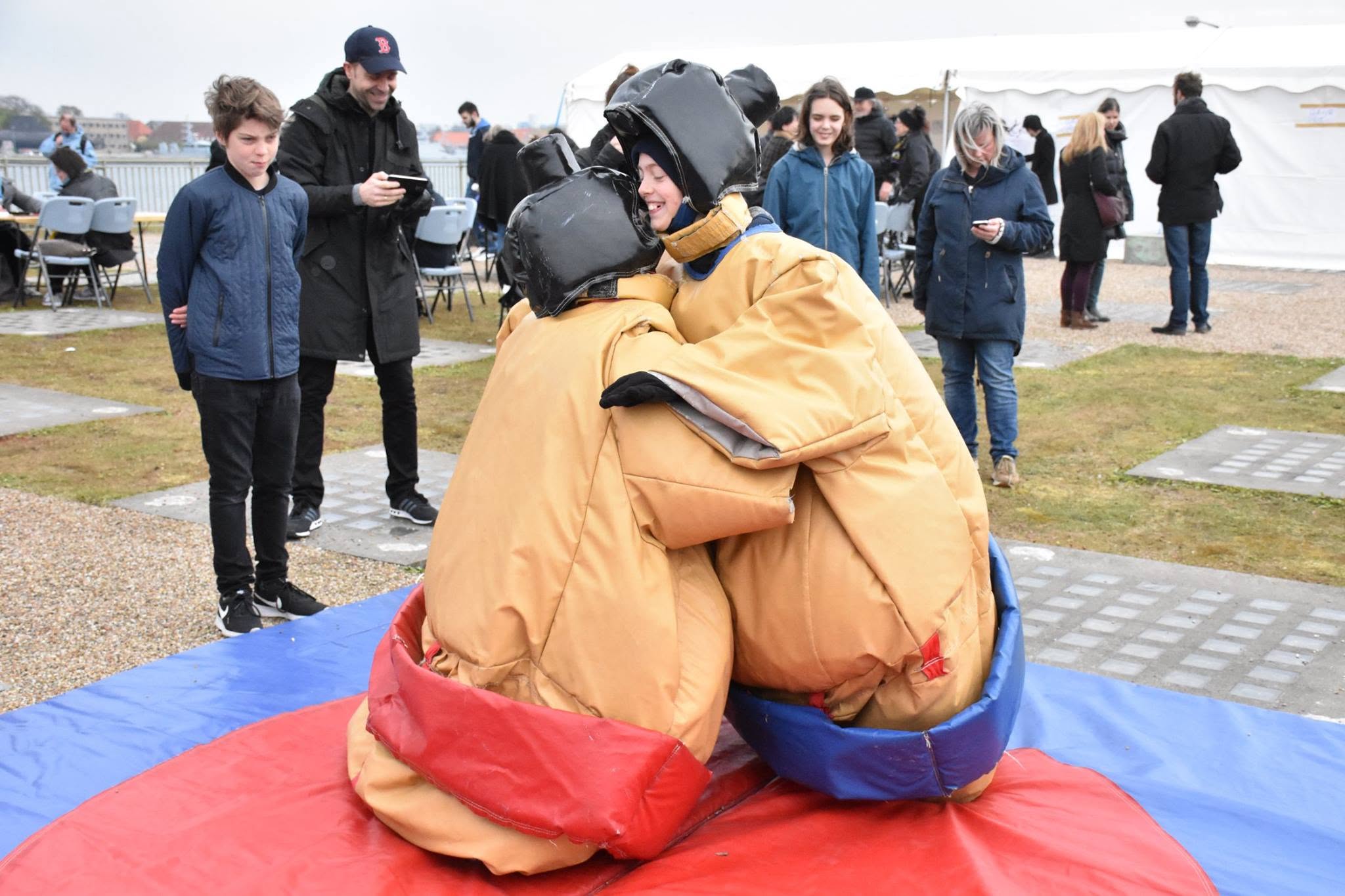 Trying sumo wrestling in padded suits