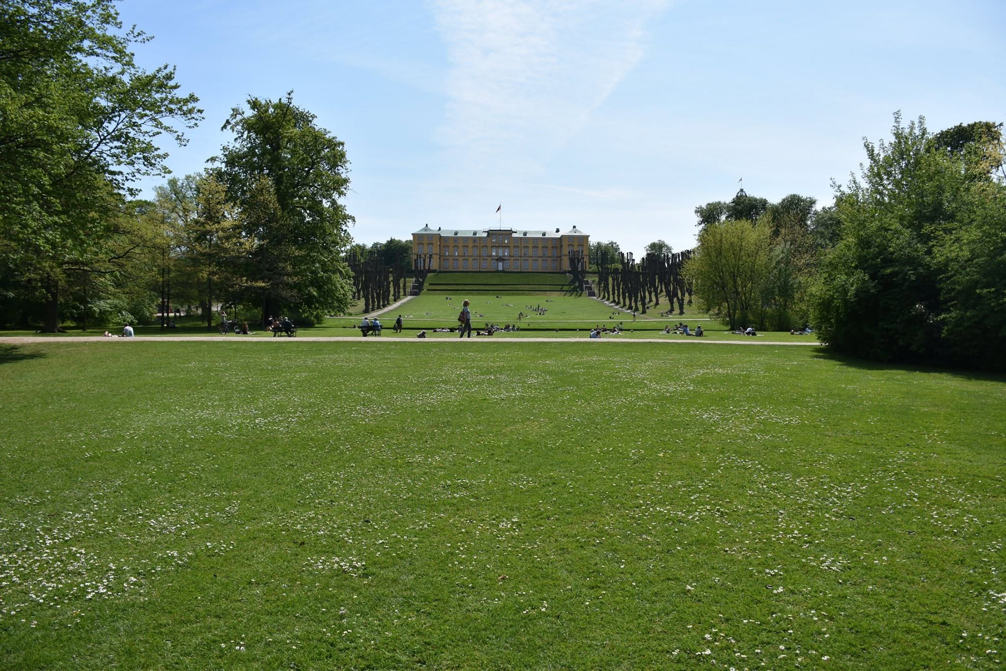 An open lawn and a view of the palace