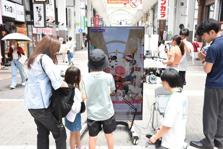 古賀研究室が開発したアプリをまちなかで紹介：大学掲載画像2